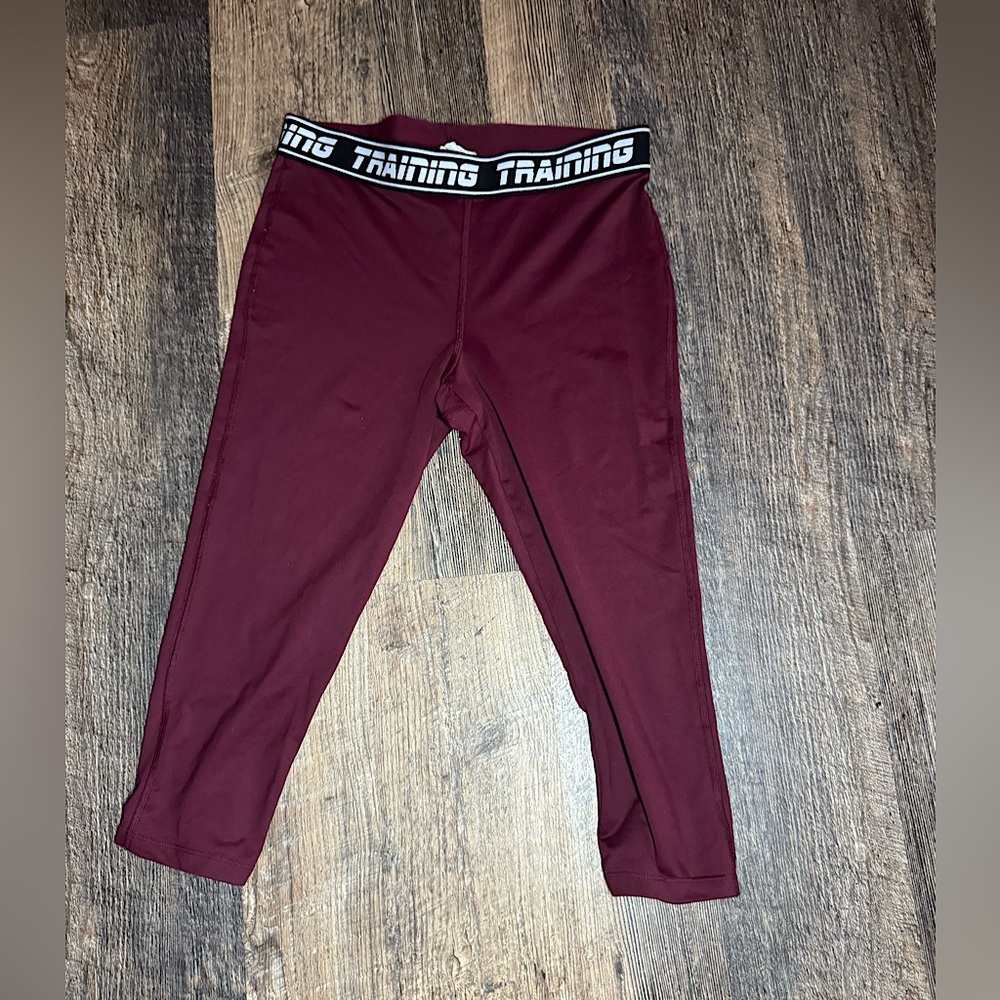 This is a maroon exercising tights from forever 21 and is a size youth small.
